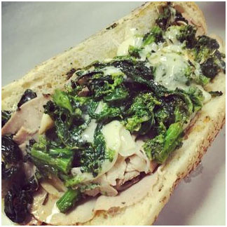 Our homemade roast pork and broccoli rabe specialty sandwich